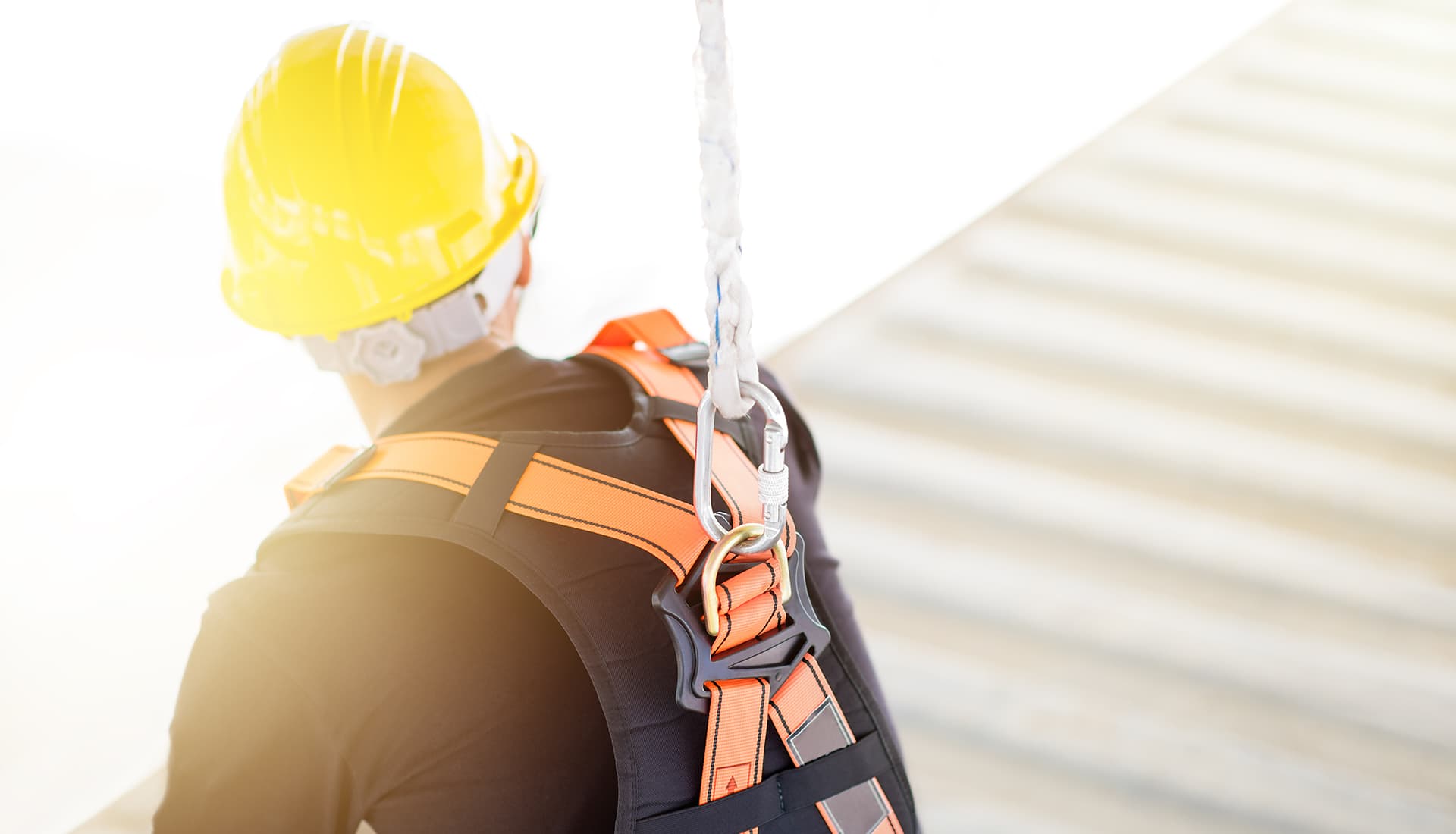 construction safety helmets on the orange wall