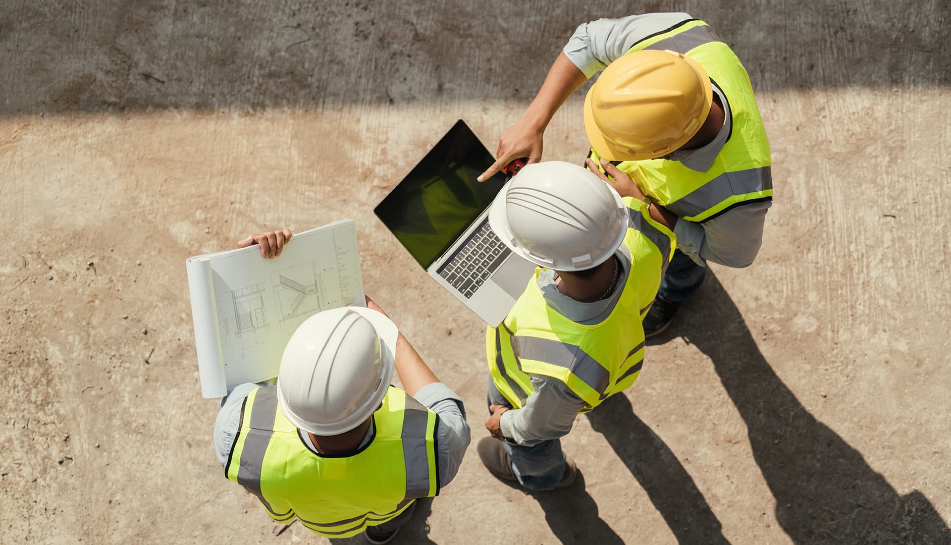 construction safety helmets on the orange wall