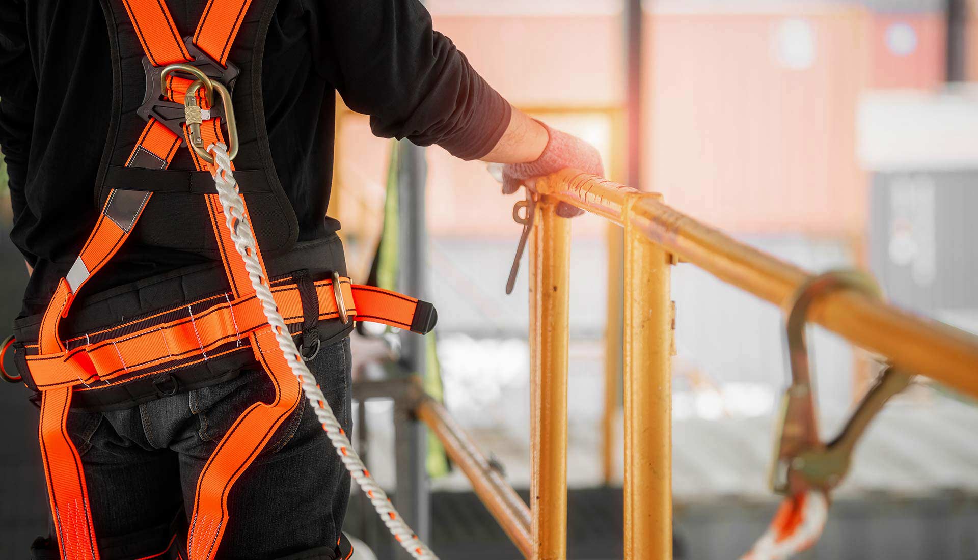 construction safety helmets on the orange wall