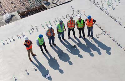 pre-shift safety meeting of workers at construction site